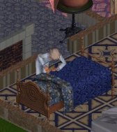 ���߂���